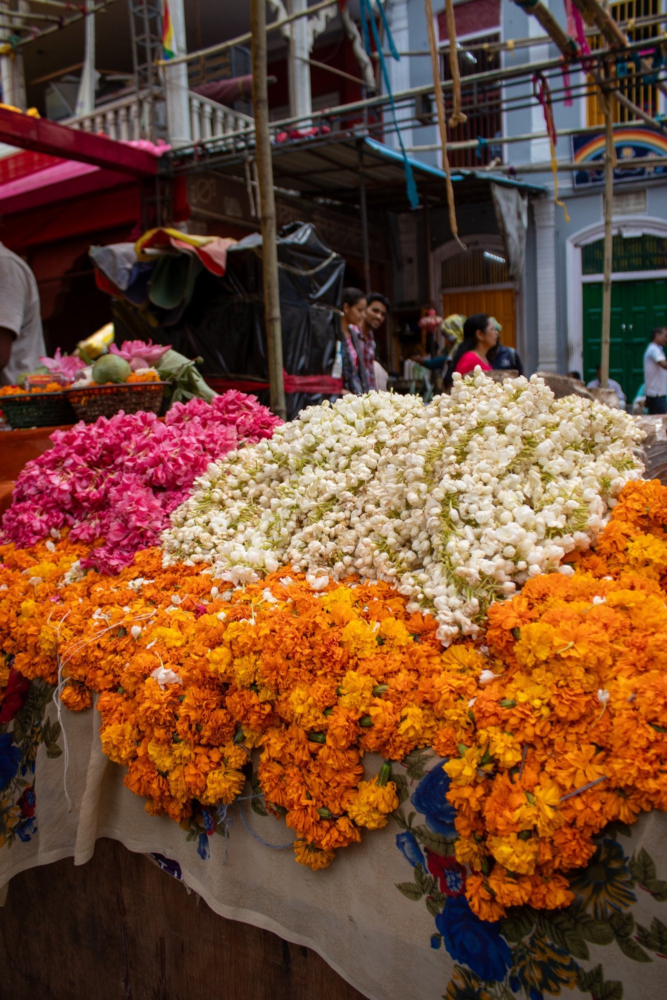Marigolds, jasmine and roses at a flower market in India