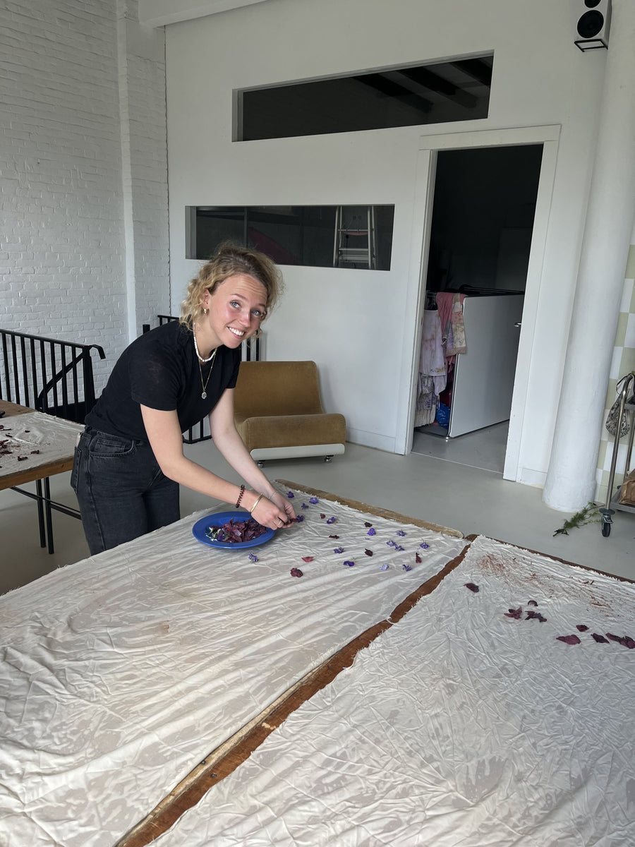 Laying flowers on fabric during our first natural dye workshop